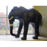 A leather model of an elephant, 34cm high