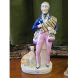 A Victorian Staffordshire figure of Sir Walter Scott with his dog Maida, 35cm high, on a line