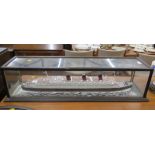 A scratch built model of the Queen Mary in a glazed case. 91cm wide, 23cm high