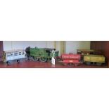 A Hornby O gauge LNER 1784 loco, three N.E. goods trucks and a Royal Daylight tanker, as found