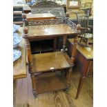 A Victorian whatnot with fret carved gallery over three tiers on turned supports and pot castors,