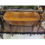 A regency mahogany D-shape foldover tea table, with ebony and boxwood stringing, and reeded turned