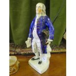 A Victorian Staffordshire figure of Benjamin Franklin, standing holding a parchment, the base with