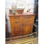 An Edwardian walnut bachelors cabinet, the raised back over two short drawers, one fitted for