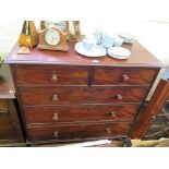 A Victorian mahogany chest of drawers with two short and three long graduated drawers on turned