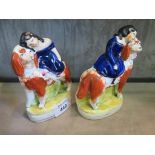 A pair of Victorian Staffordshire figures of a girl seated on a spaniel on an ovoid base, 13cm