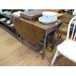 An oak gateleg table, the oval top with barley-twist legs, 104cm wide