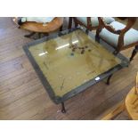 A Bombitaire games table, with smoked glass top, cabriole legs and pad feet, 83cm square