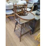 An Edwardian beech metamorphic child's high chair, converting to a play table on wheels, with cane