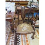 An Edwardian mahogany armchair with decorative brass marquetry in back splat and brass stringing