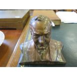 A patinated bronze bust of Caruso, inscribed on the base, 18cm high