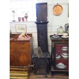 A mid 18th century oak longcase clock, with later carving to the matched case, the brass dial with