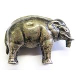 A silver elephant pin cushion