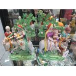 A pair of early 19th Century Staffordshire figure groups depicting the Holy Family's Flight into