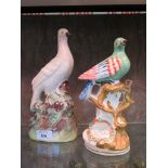 A Victorian Staffordshire figure of a dove on a naturalistic base, 26cm high, and another of an