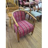 A beech tub armchair, with tartan upholstery, turned arm supports and legs