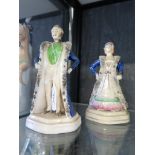 A pair of Victorian Staffordshire figures depicting Prince Charming and Cinderella on octagonal