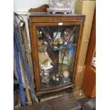 A mahogany bowfront display cabinet, on cabriole legs with ball and claw feet, 58cm wide, 130cm