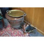 AN OLD COPPER LOG BIN of riveted construction with tubular base and circular lid, 54cm diameter