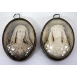 A PAIR OF ANTIQUE CONTINENTAL PLASTER DEVOTIONAL MEDALLIONS, one depicting Christ the other the