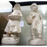 A PAIR OF PLASTER FIGURES one of a Dutch boy and the other of a Dutch girl, both wearing clogs 38.