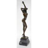 A CONTEMPORARY BRONZE SCULPTURE OF A SEMI NUDE DANCING GIRL wearing a thong and high heels, the base