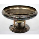 AN ARTS AND CRAFTS TAZZA of shallow hammered form, silver plated on brass and copper and of