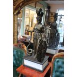 A CONTEMPORARY BRONZE SCULPTURE OF A ROMAN GODDESS ATHENA wearing a plumed helmet, supporting a