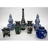 A PAIR OF ANTIQUE CHINESE BLUE AND WHITE DOUBLE GOURD VASES, each with dragon decoration and four