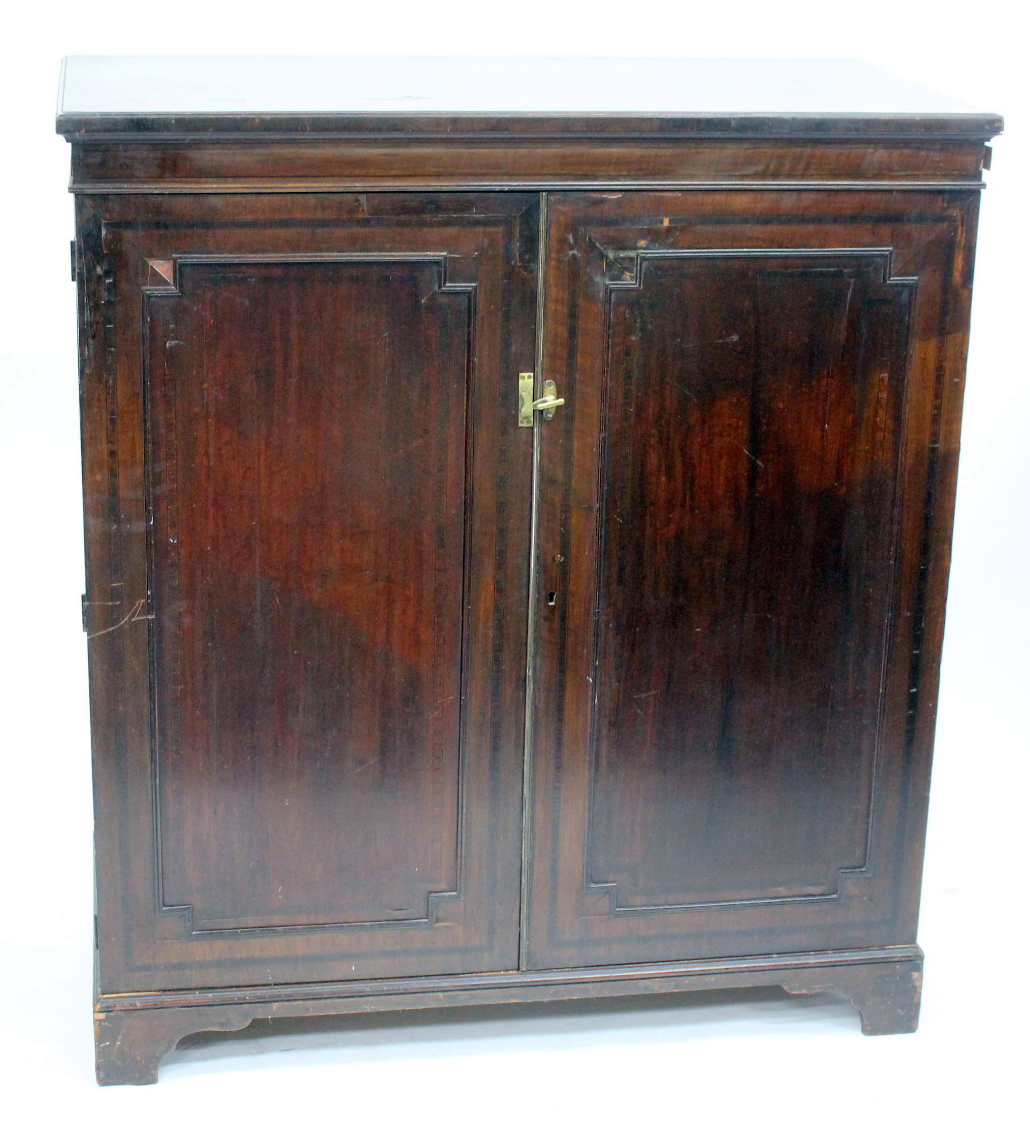 A 19TH CENTURY MAHOGANY LINEN PRESS the two panelled doors opening to reveal four sliding linen