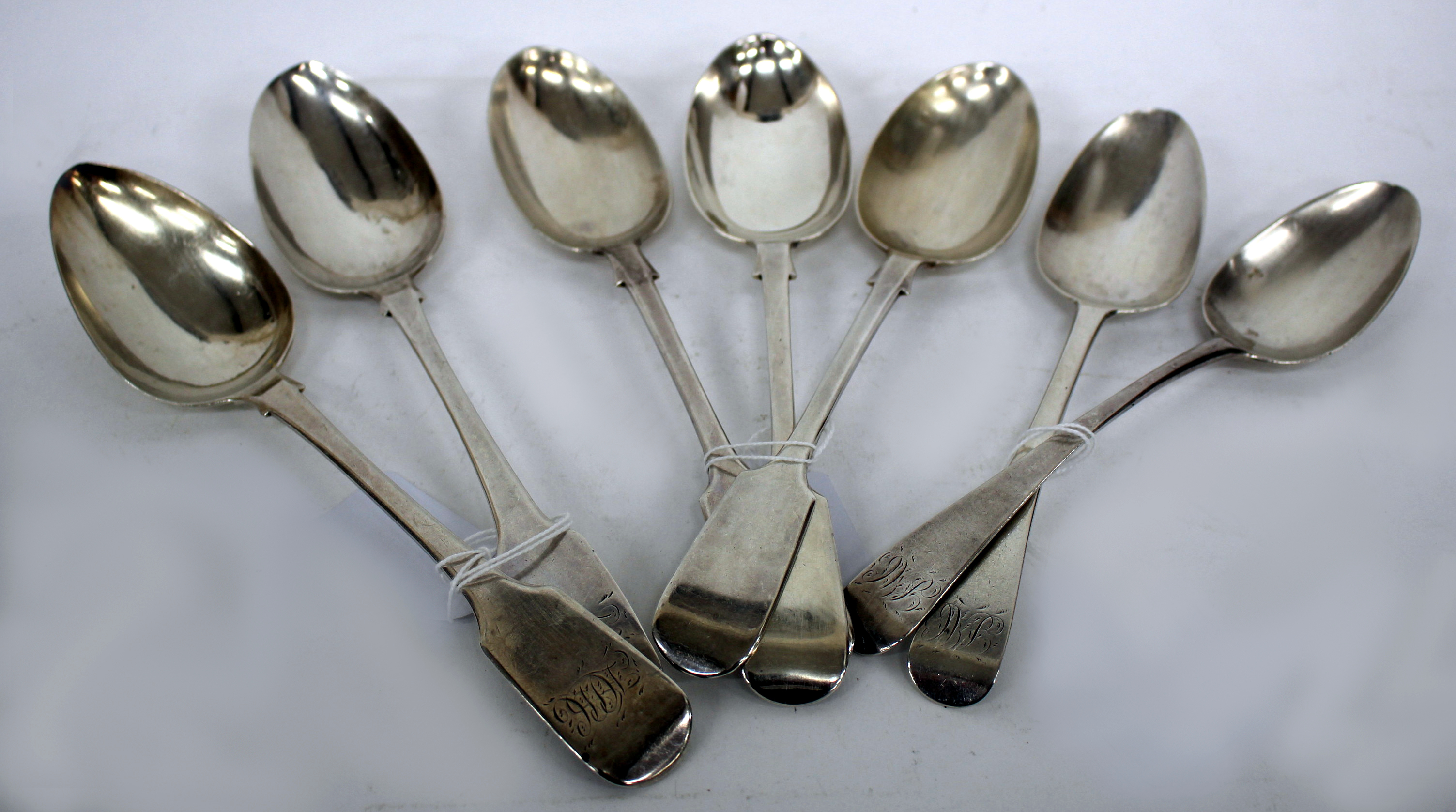 THREE EARLY 20TH CENTURY SILVER FIDDLE PATTERN TABLE SPOONS, each with marks for London 1902, a pair