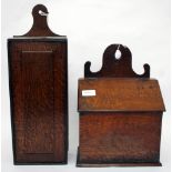 AN ANTIQUE OAK CANDLE BOX with a fret carved back and a sloping lid 24cm wide together with a 19th
