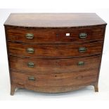 A VICTORIAN MAHOGANY BOW FRONTED CHEST OF FOUR LONG DRAWERS with splayed bracket feet, 103cm wide