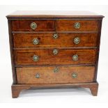 AN 18TH CENTURY WALNUT CHEST of two short and three long drawers with later brass handles and