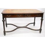 A WALNUT LIBRARY TABLE with a leather inset top, two frieze drawers and tapering fluted legs