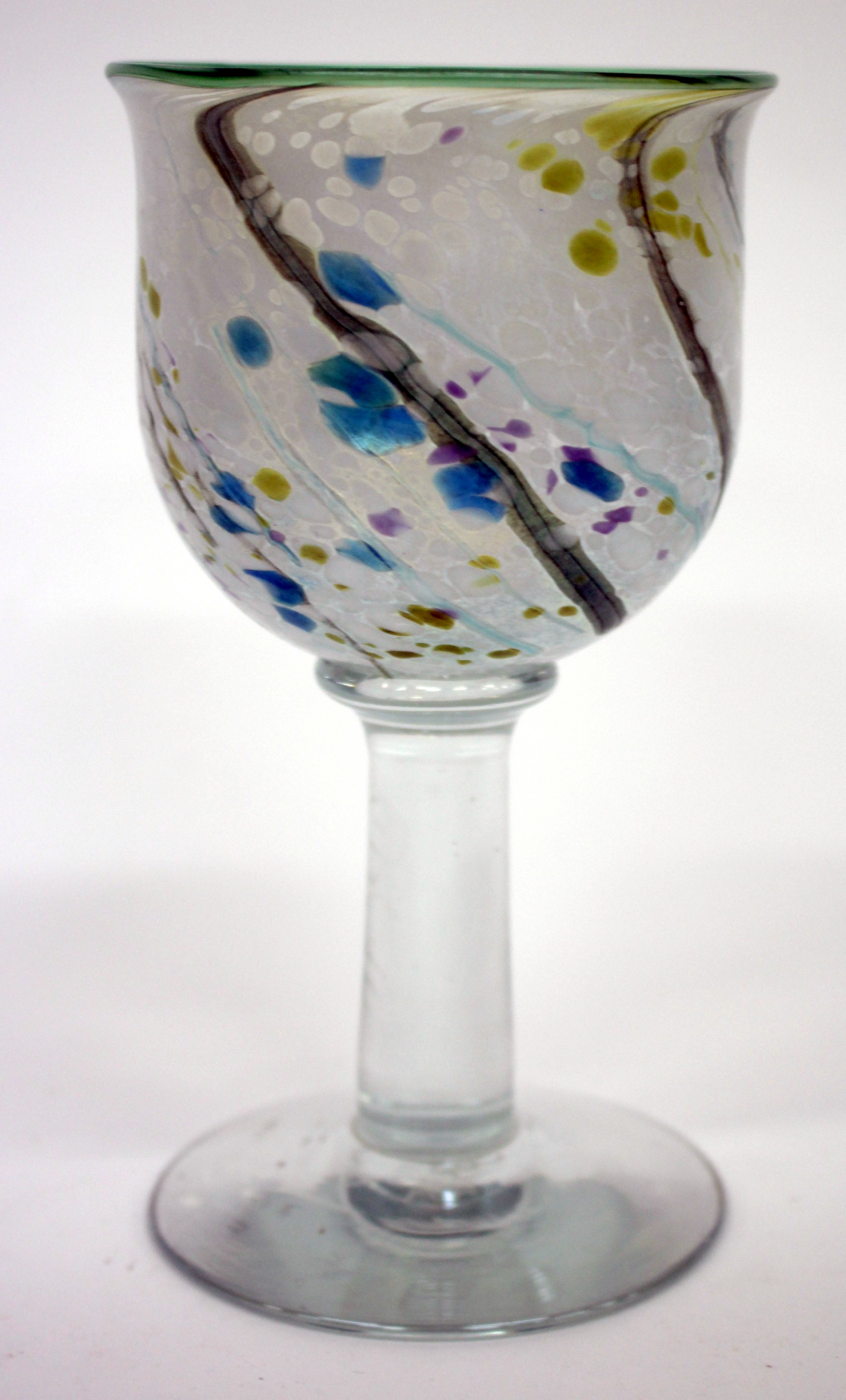 A TIFFANY FAVRILE GLASS WINE GOBLET, the bowl with swirling design and on tapering stem and circular