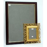 A RECTANGULAR WALL MIRROR with a detailed scrolling pierced gesso frame 35cm x 40cm together with