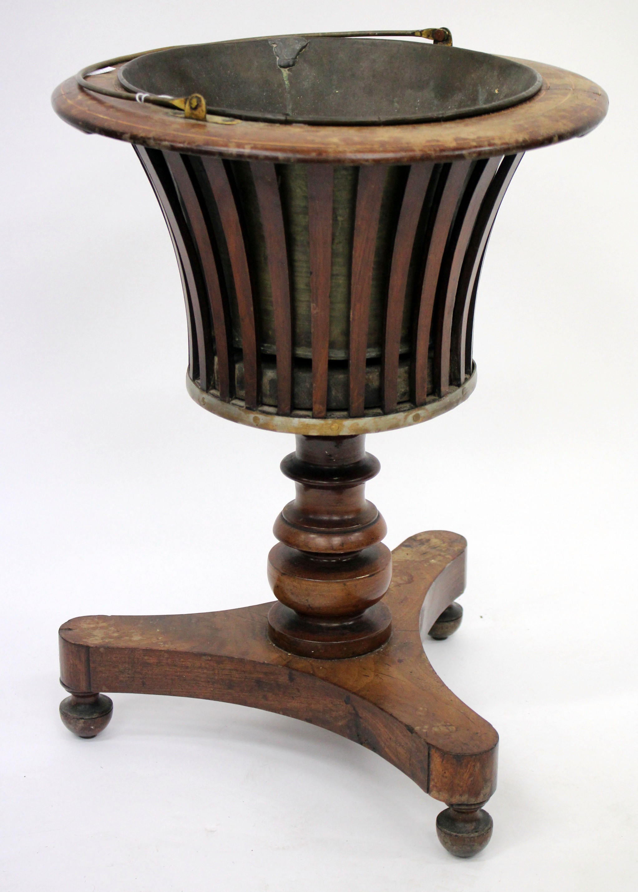 A 19TH CENTURY WALNUT AND TOLEWARE JARDINIERE with pierced slatted sides, a turned  stem and a