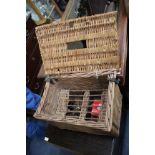 AN OLD WICKER FISHING CREEL and a small group of fishing reels
