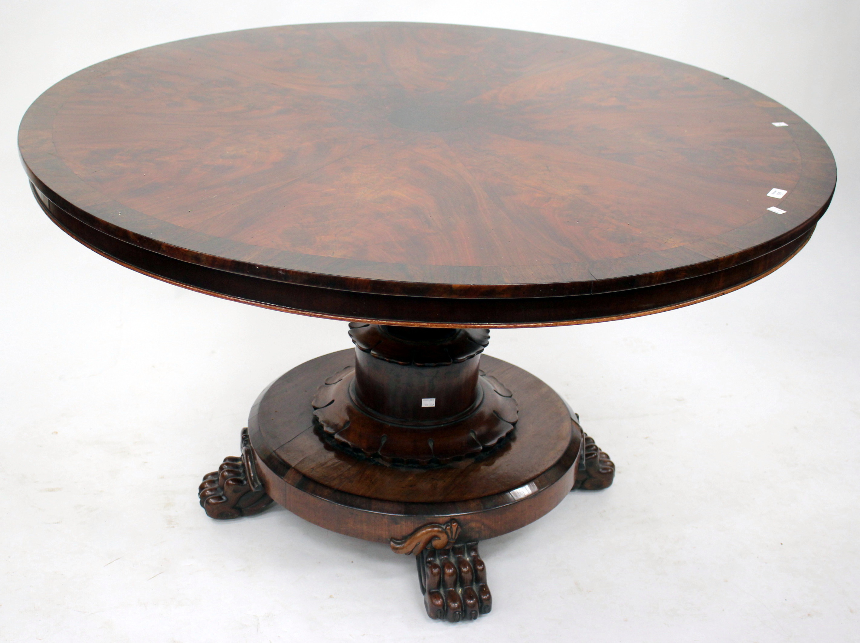 A 19TH CENTURY FLAME MAHOGANY CIRCULAR BREAKFAST TABLE with an octagonal column support and a