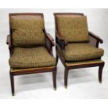 A PAIR OF 20TH CENTURY MAHOGANY BERGERE ARMCHAIRS with upholstered cushions and sabre legs, each