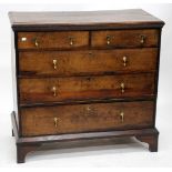 AN ANTIQUE OAK CHEST OF TWO SHORT AND THREE LONG DRAWERS with brass drop handles and standing on