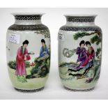 TWO SIMILAR CHINESE OVOID VASES, decorated with figures in landscapes and having flaring rims and