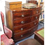 AN EARLY 19TH CENTURY MAHOGANY BOW FRONTED CHEST OF TWO SHORT AND THREE LONG DRAWERS with brass ring