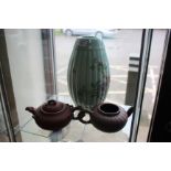A CHINESE YIXING TEA POT, 22cm wide together with a further Chinese Yixing style tea pot and a