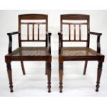 A SET OF SIX ROSEWOOD COLONIAL ARMCHAIRS with splat backs, bergere seats and turned front feet