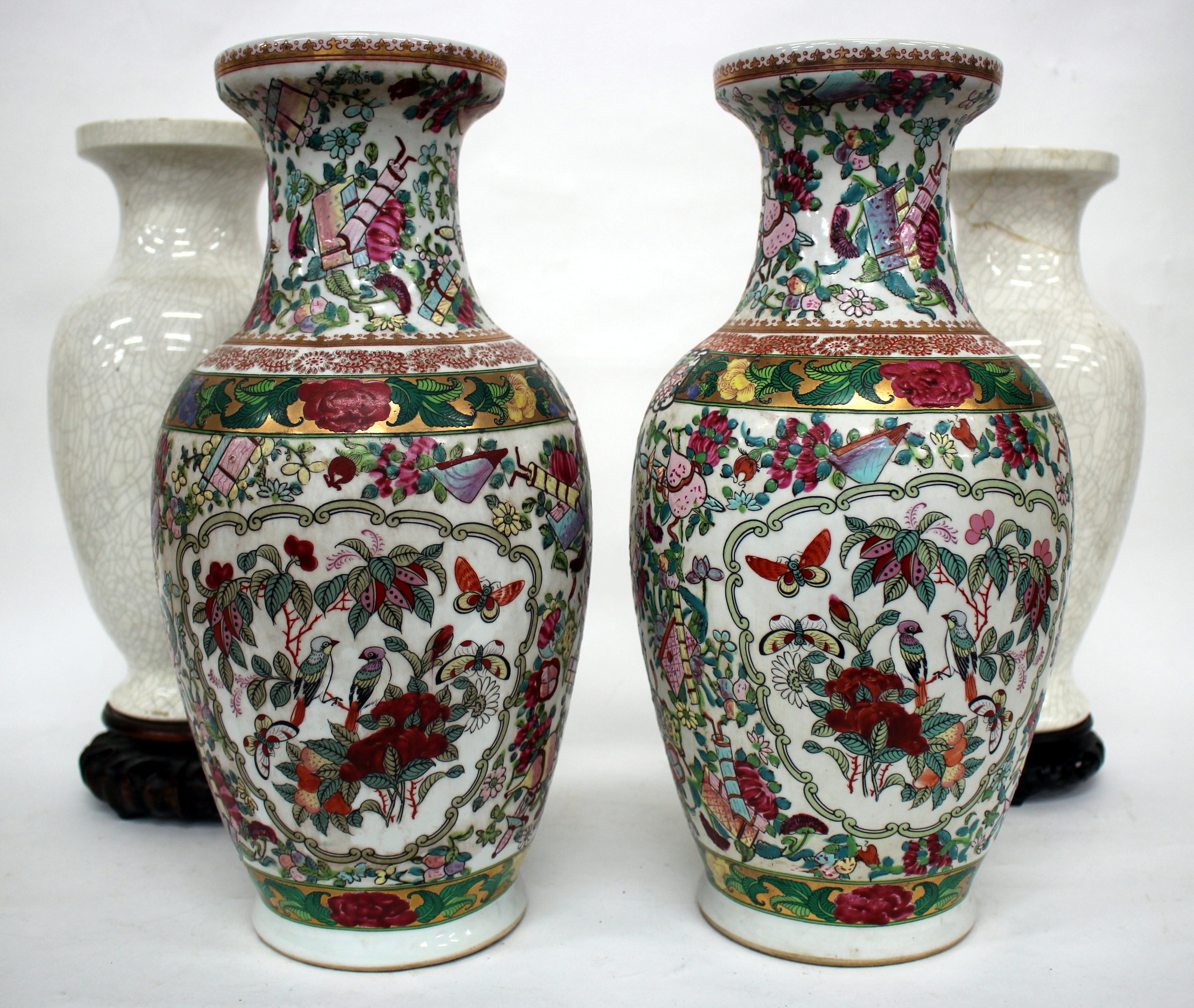 A PAIR OF CHINESE VASES of baluster form painted with birds amongst flowering branches in colours,