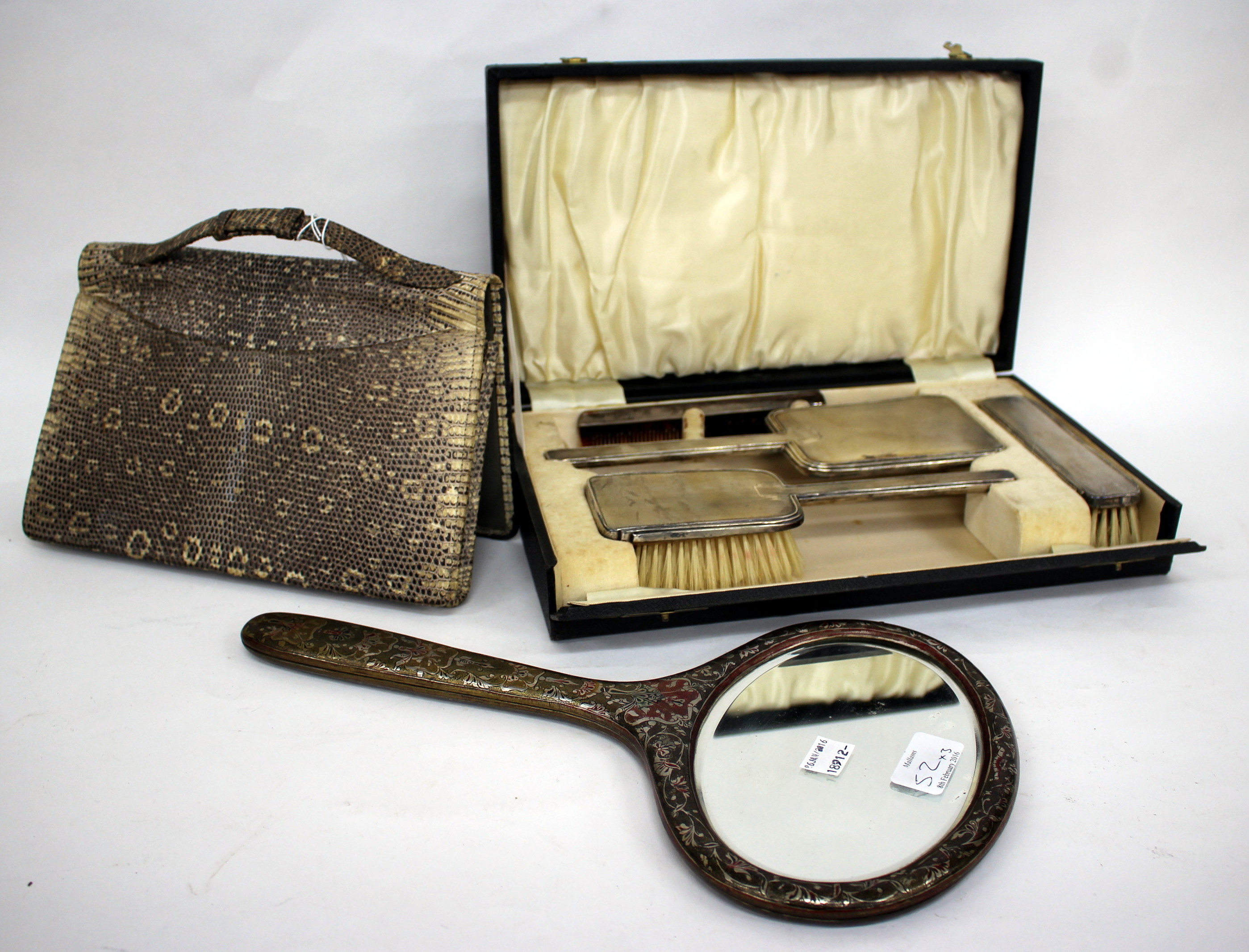 AN ART DECO STYLE SILVER BACKED DRESSING SET with marks for Birmingham 1940 in a fitted case,