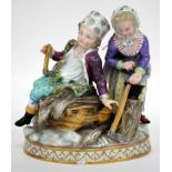 A 19TH CENTURY MEISSEN PORCELAIN FIGURAL GROUP, a woodsman and his wife, 14cm in height