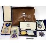 A GROUP OF MASONIC MEDALS to include a 9 carat gold banded Honorable Testimonial of Masonic
